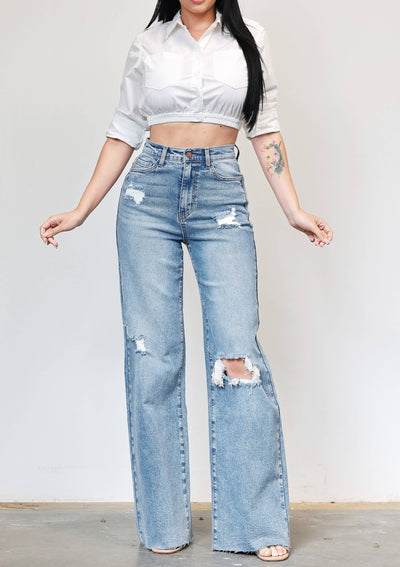 High rise light wash 90s inspired wide leg jeans with distressed details