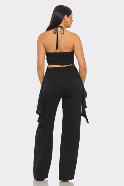 Back view black halter two piece pant set from She Rare Boutique