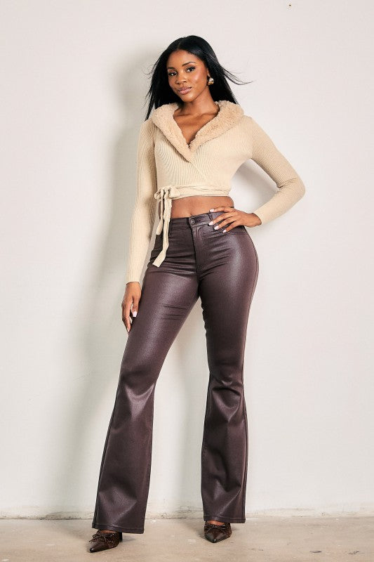 Brown Sugar Coated Boot Cut Jeans front view, high rise brown coated jeans styled with a cream cropped sweater and heels