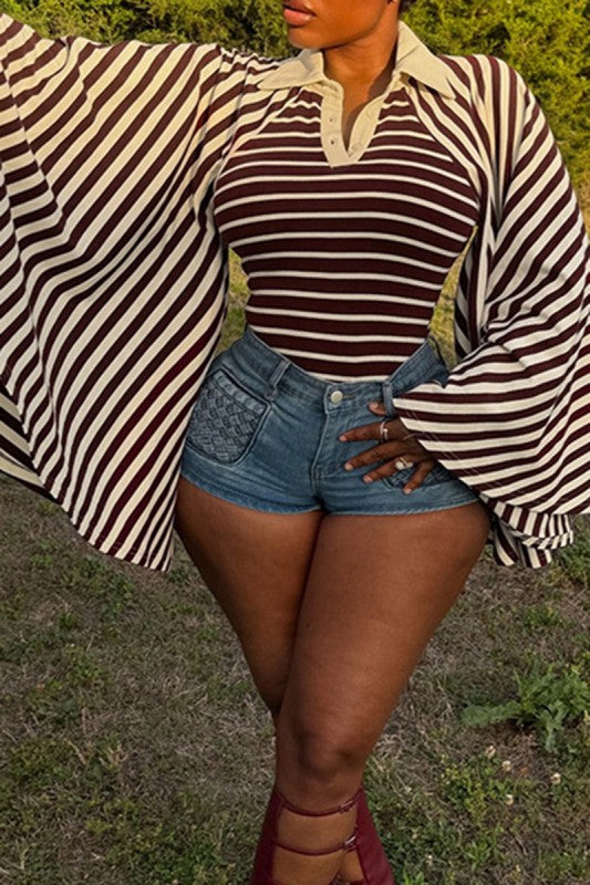 Grand Entrance Top in brown front view on body, cream collar and oversized striped cape sleeves with denim shorts